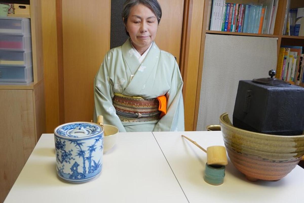 a woman standing in front of a table with bowls