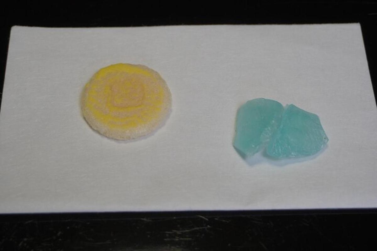 a piece of paper with a donut and a piece of candy