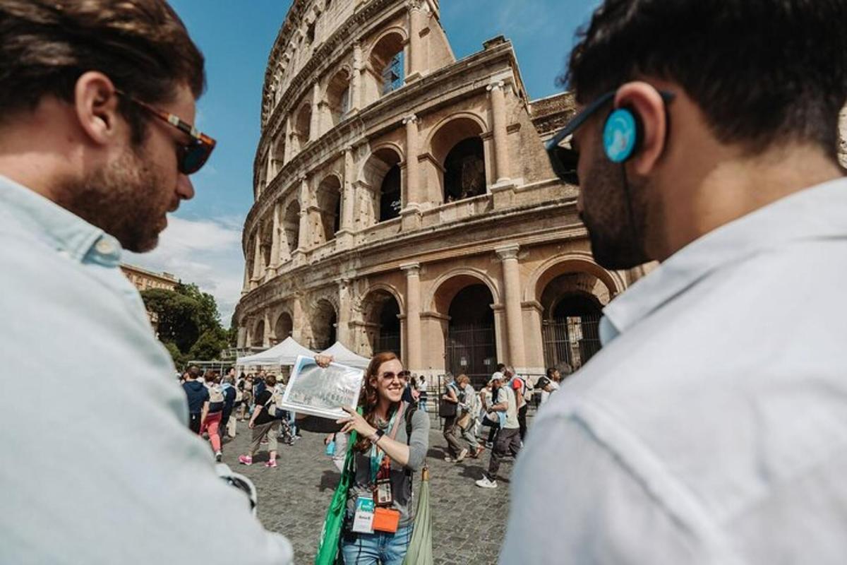 a group of people standing in front of the coliseum