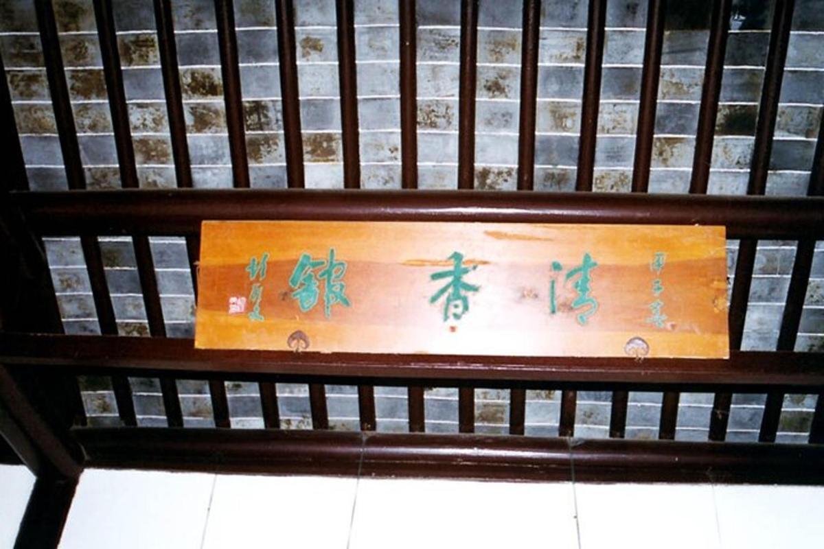 a sign on a bench with writing on it