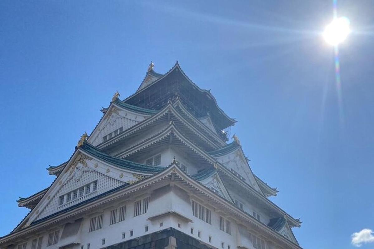 a tall white tower with a blue sky in the background