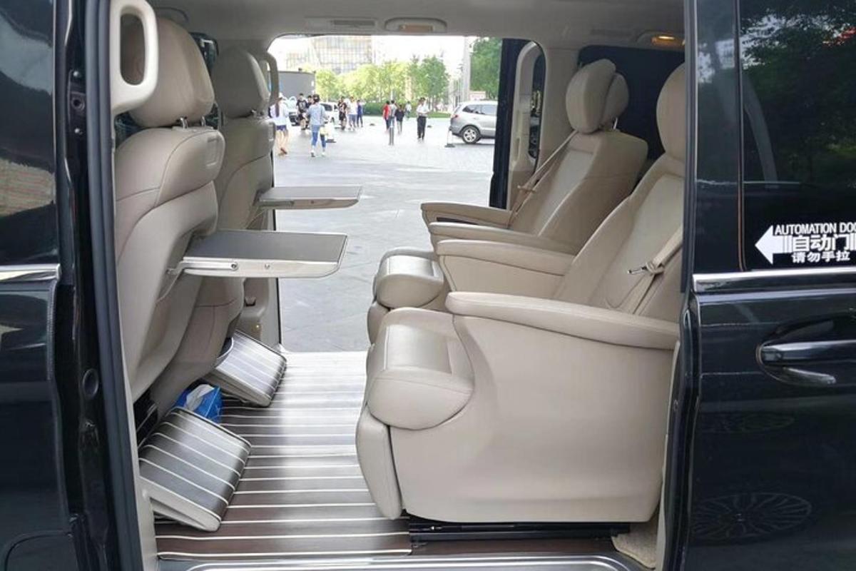 a van with its doors open with the seats down