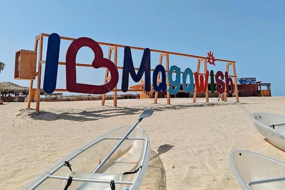a sign for a playground on the beach