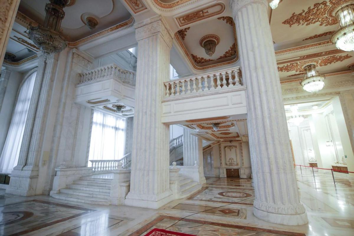 a large building with columns and a staircase