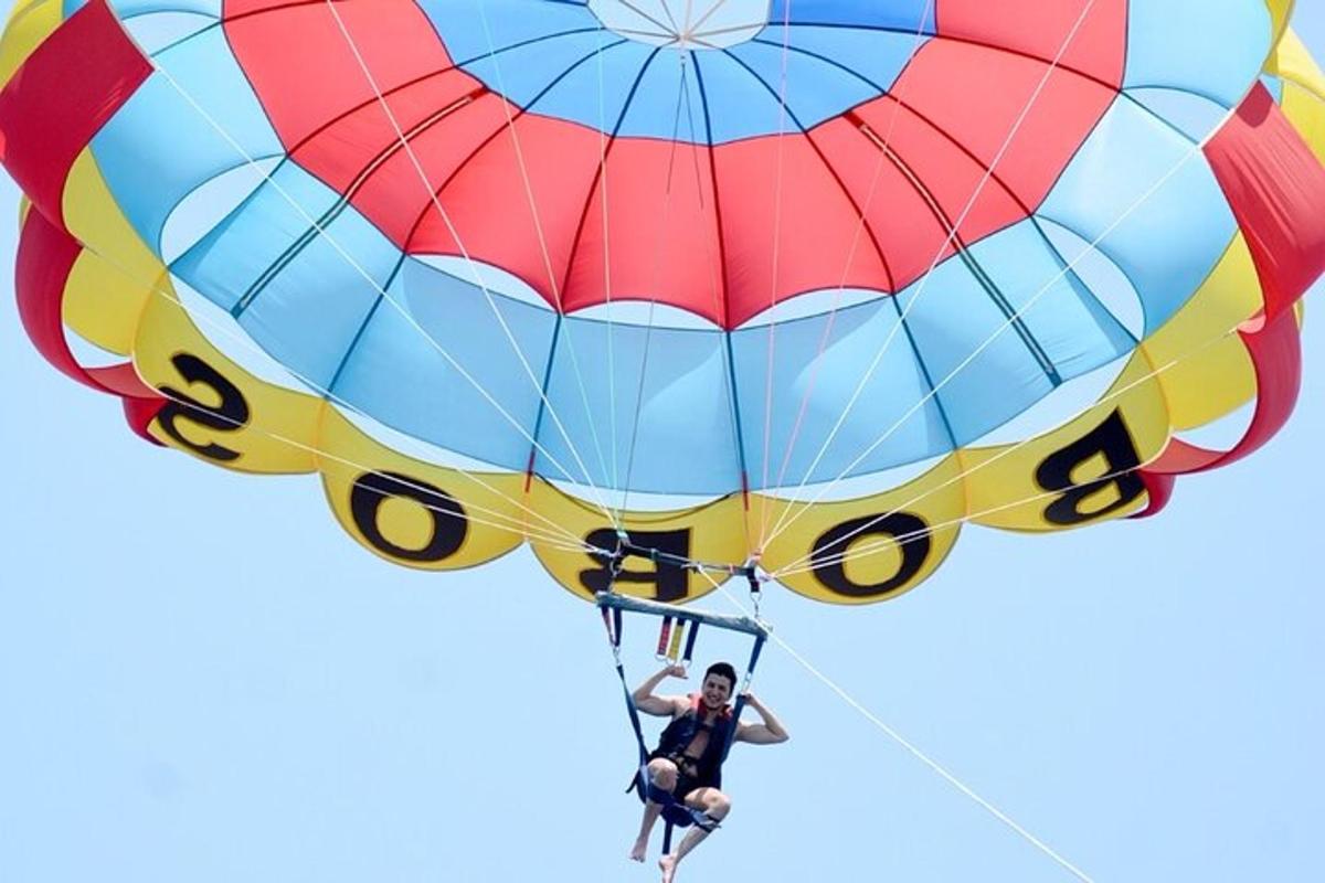 a man is hanging from a parachute