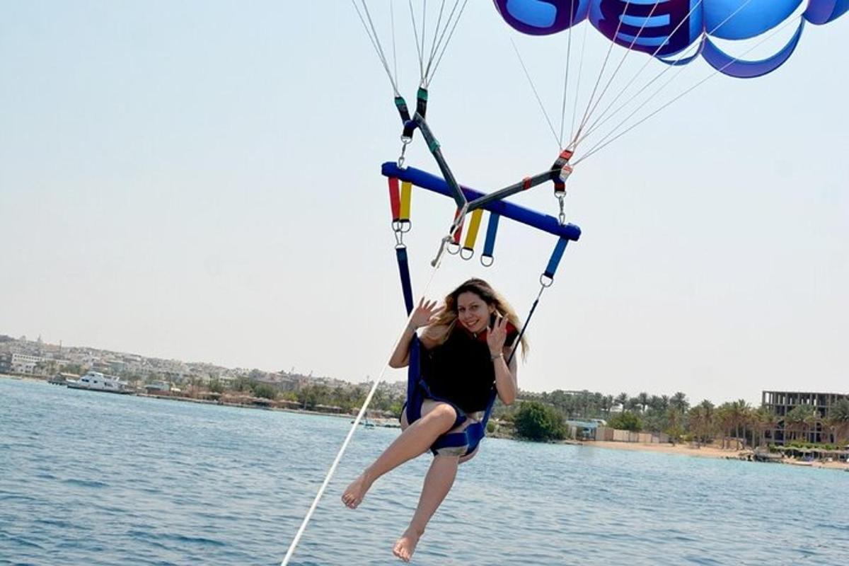 a woman is on a cell phone in a parachute
