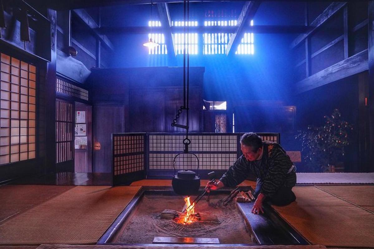 a man is cooking over a fire in a room
