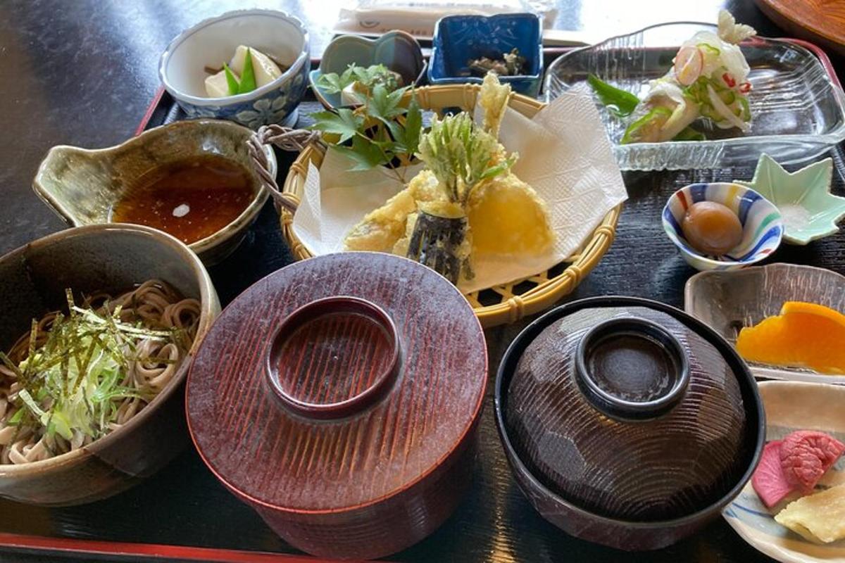 a table topped with bowls and plates of food