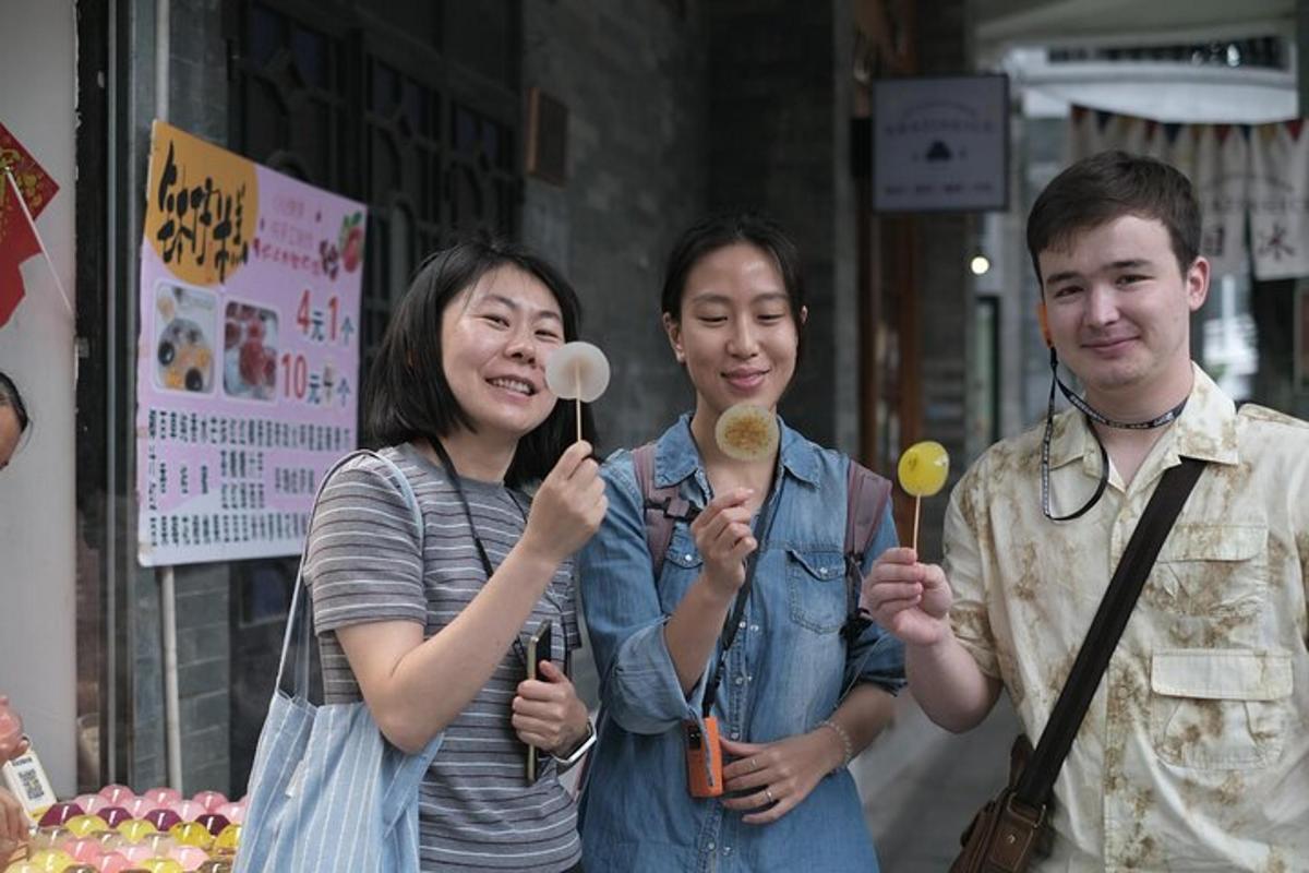 a group of three people holding up lollipops