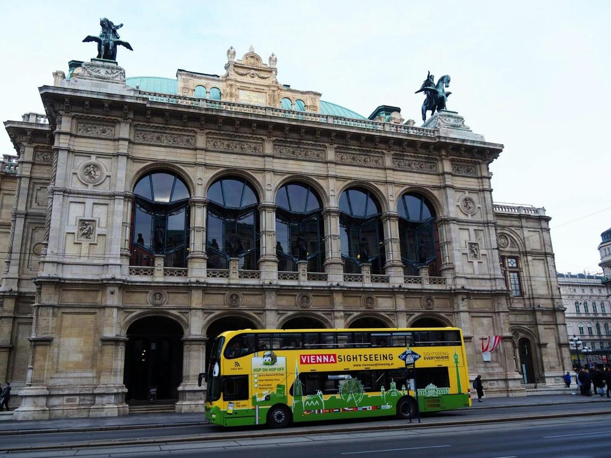 a yellow double decker bus parked in front of a building