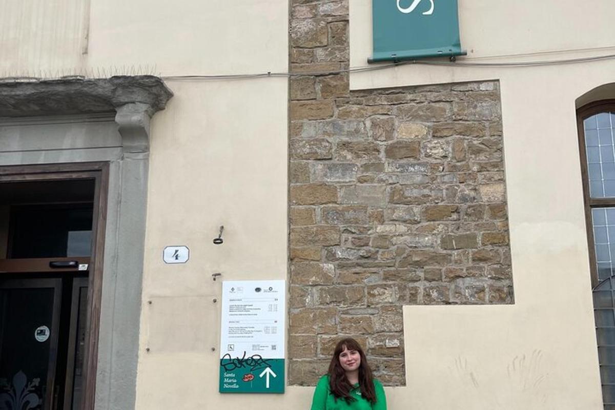 a woman standing in front of a building