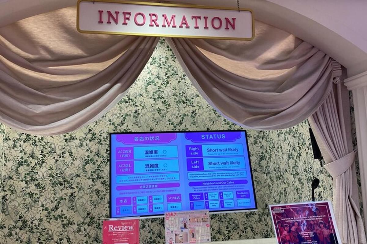 a sign that says information in front of a window