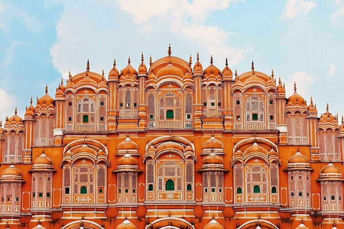 a large orange building with a lot of windows