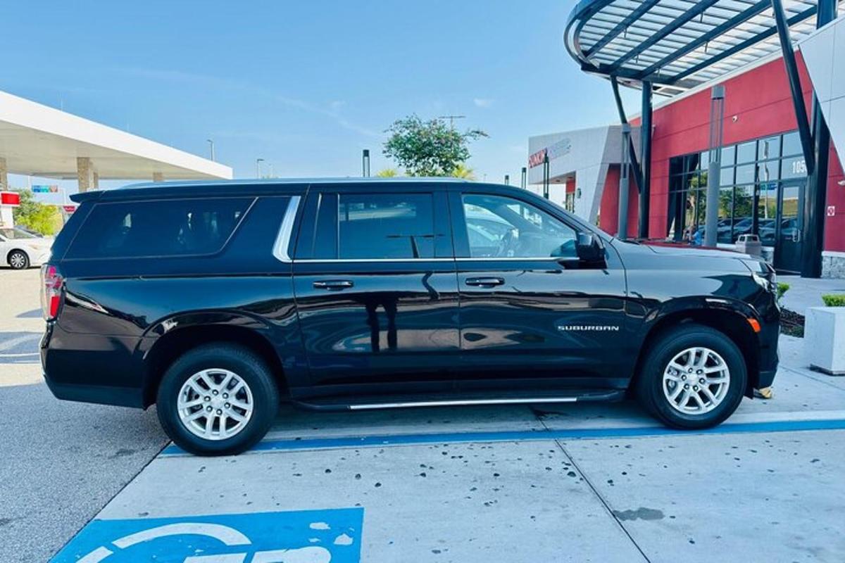 a black suv parked in a parking lot