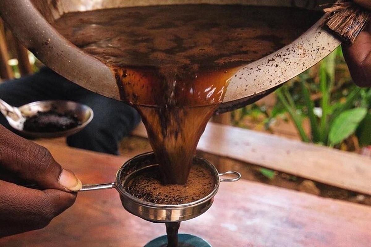 a person is pouring coffee into a pot
