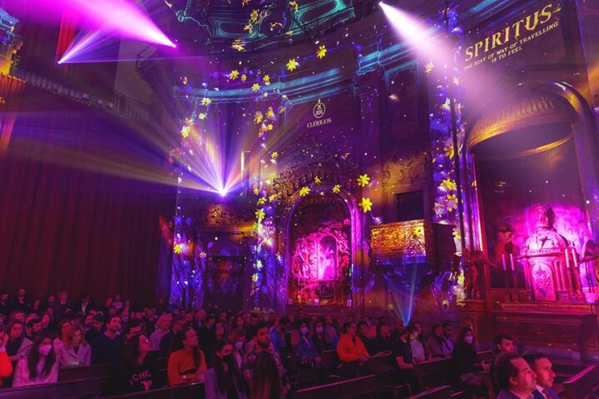 a crowd of people in a room with lights