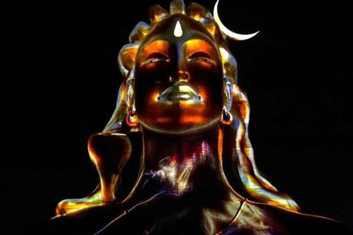 a statue of a buddha with a moon on its face