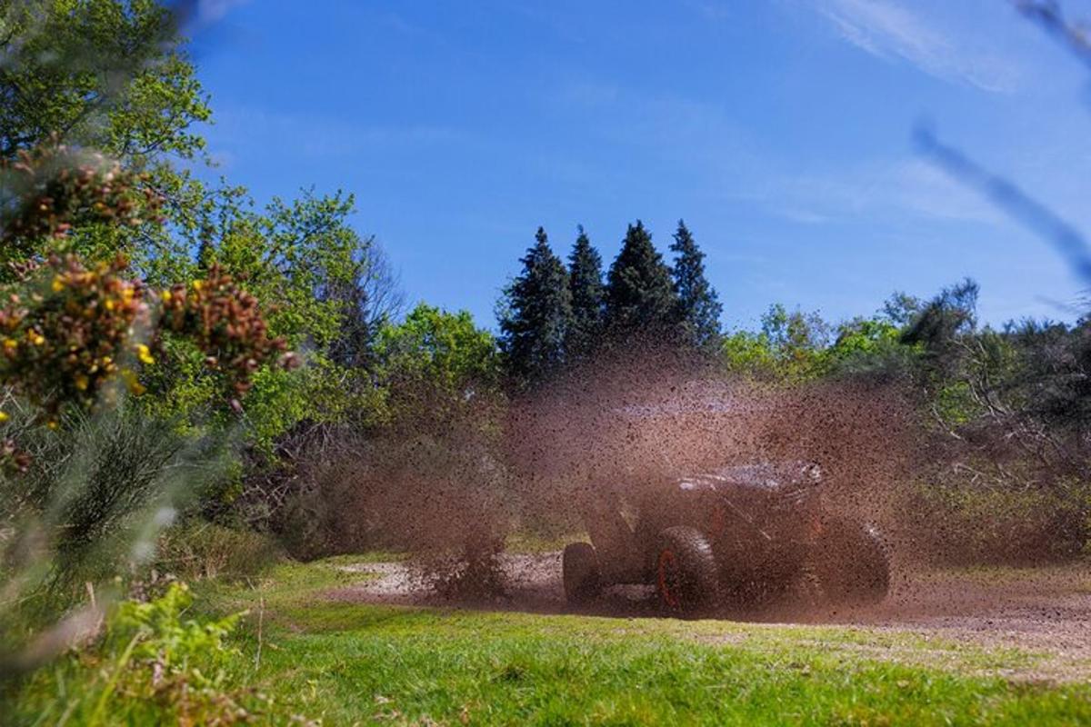 a truck is driving down a dirt road