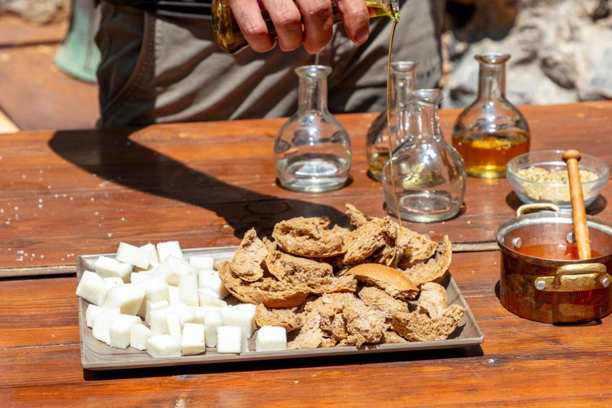 a person is preparing food on a wooden table