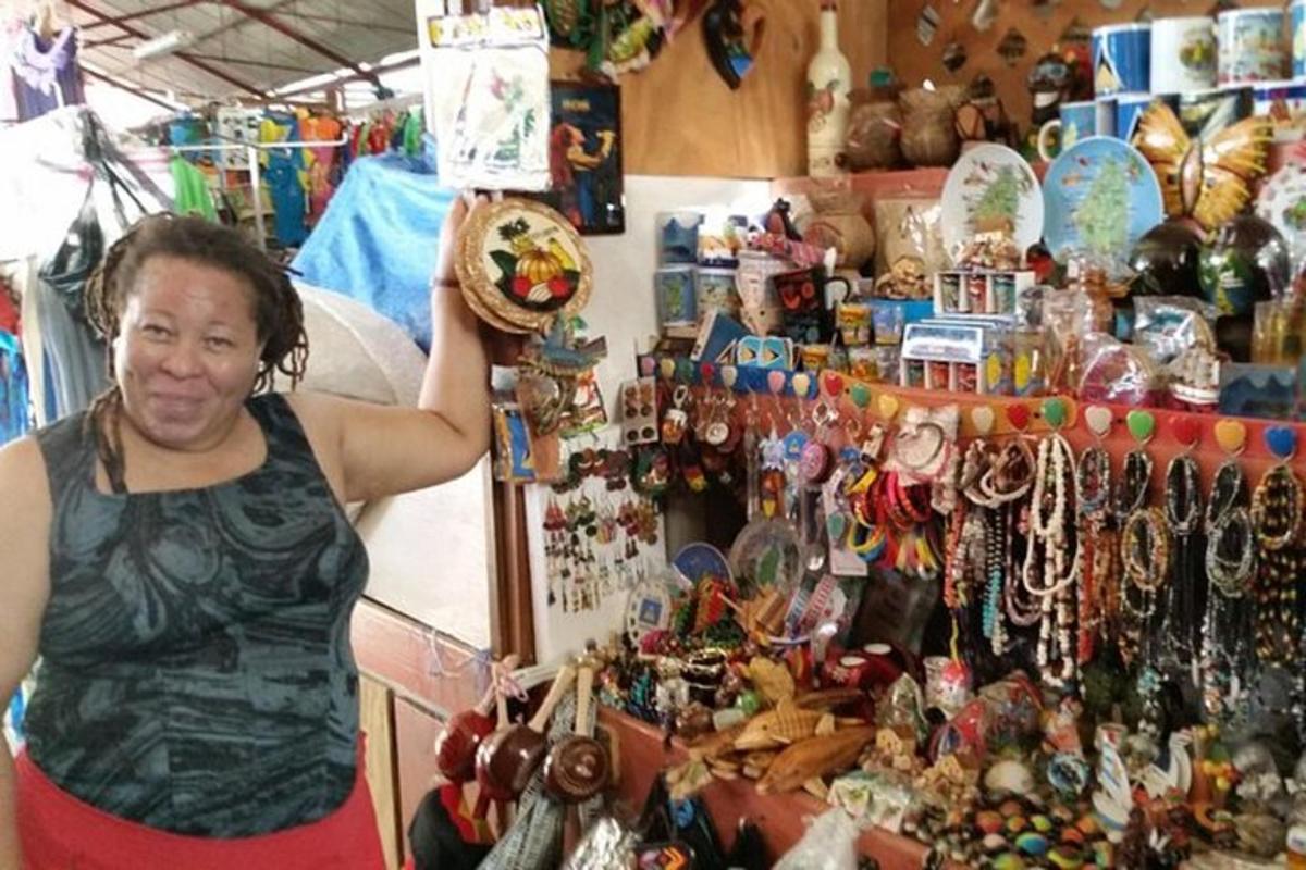 a woman standing in a store with a display ofthings