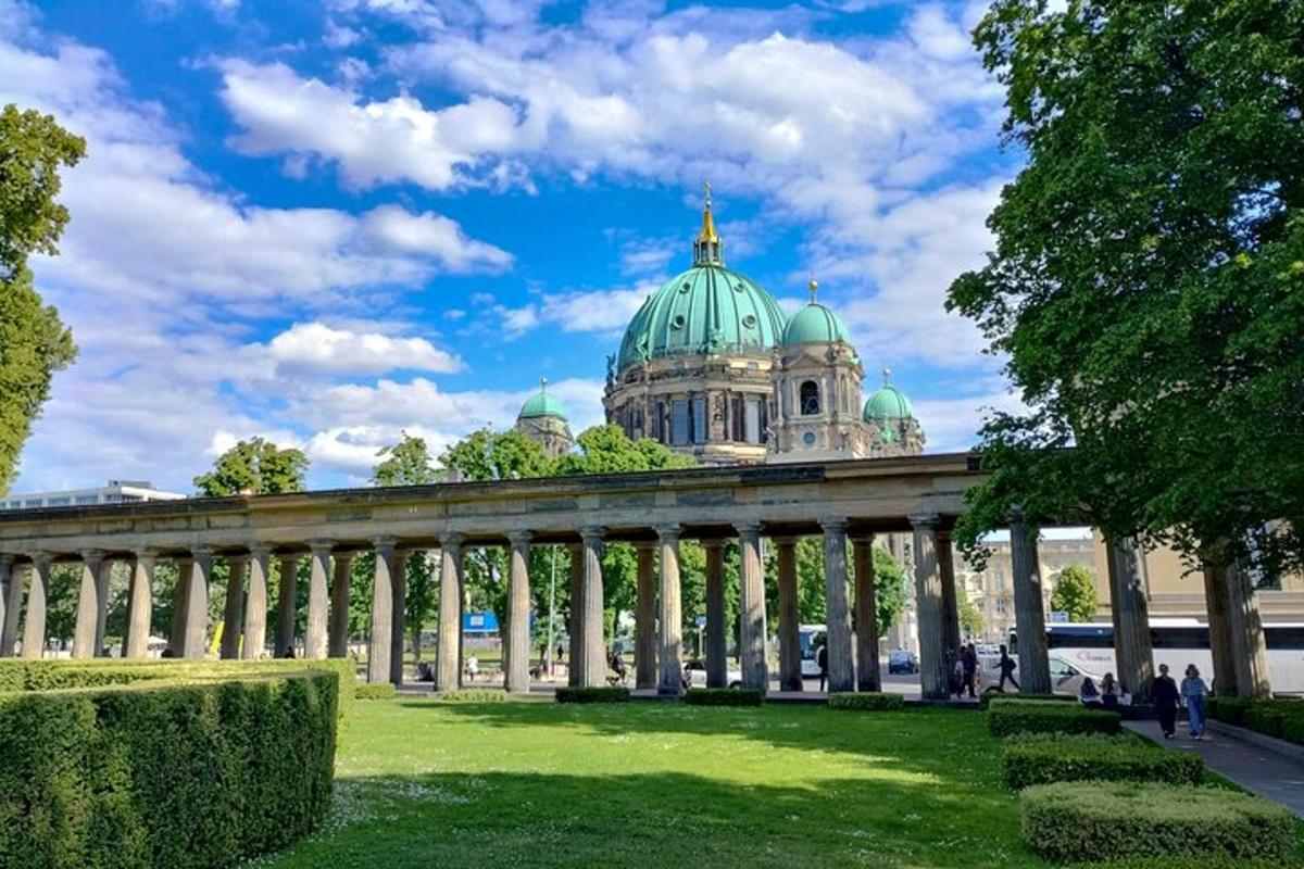 a large building with a green dome on top