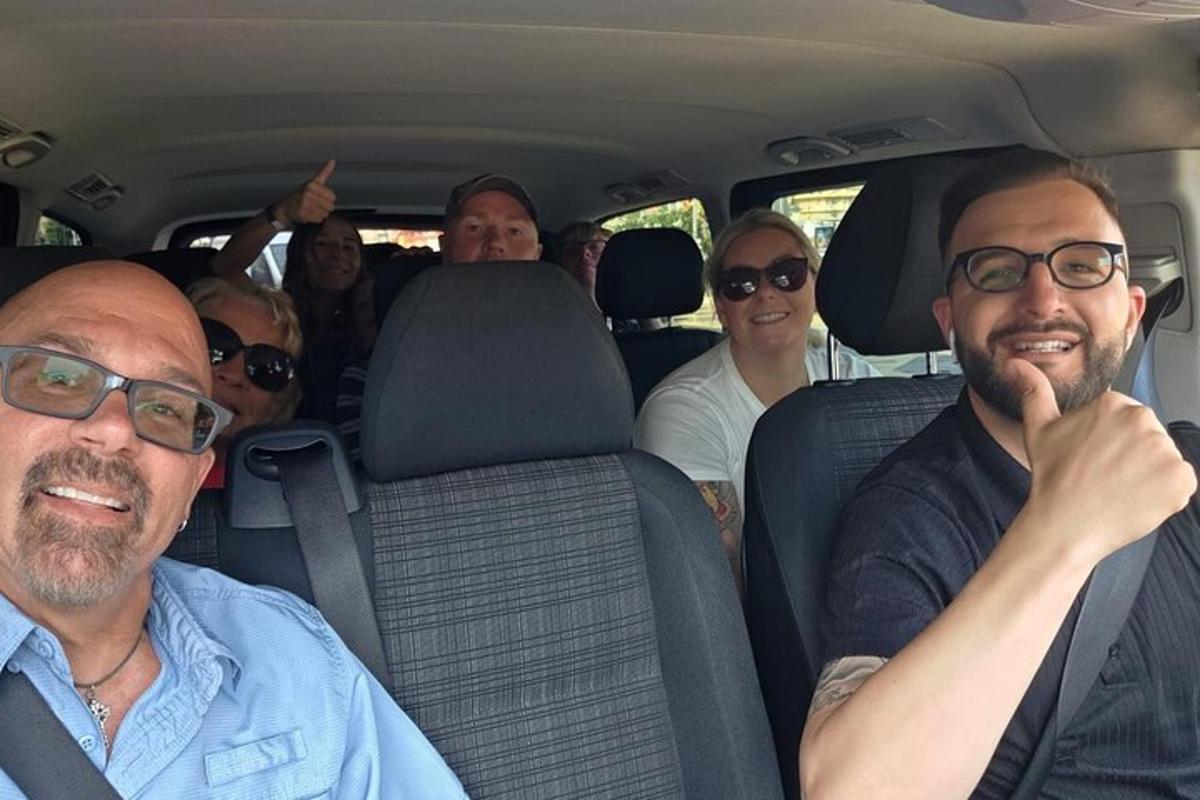 a group of people sitting in the back of a car