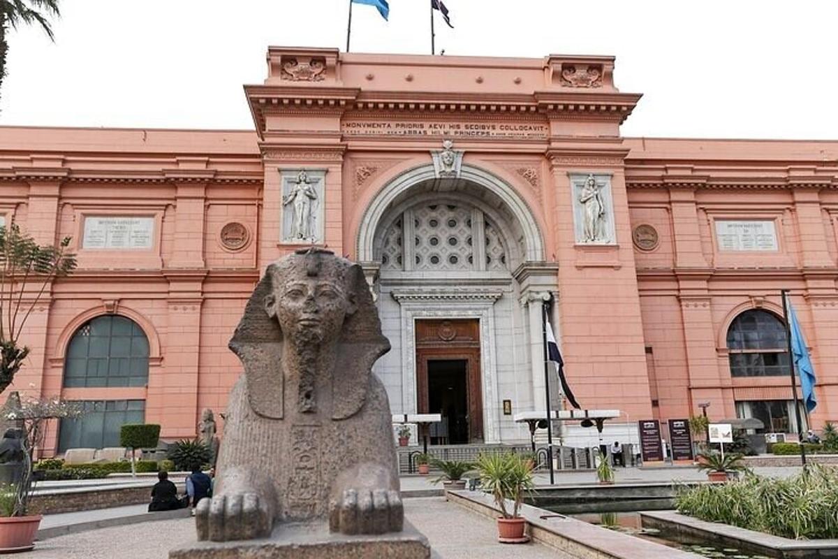 a large building with a statue in front of it