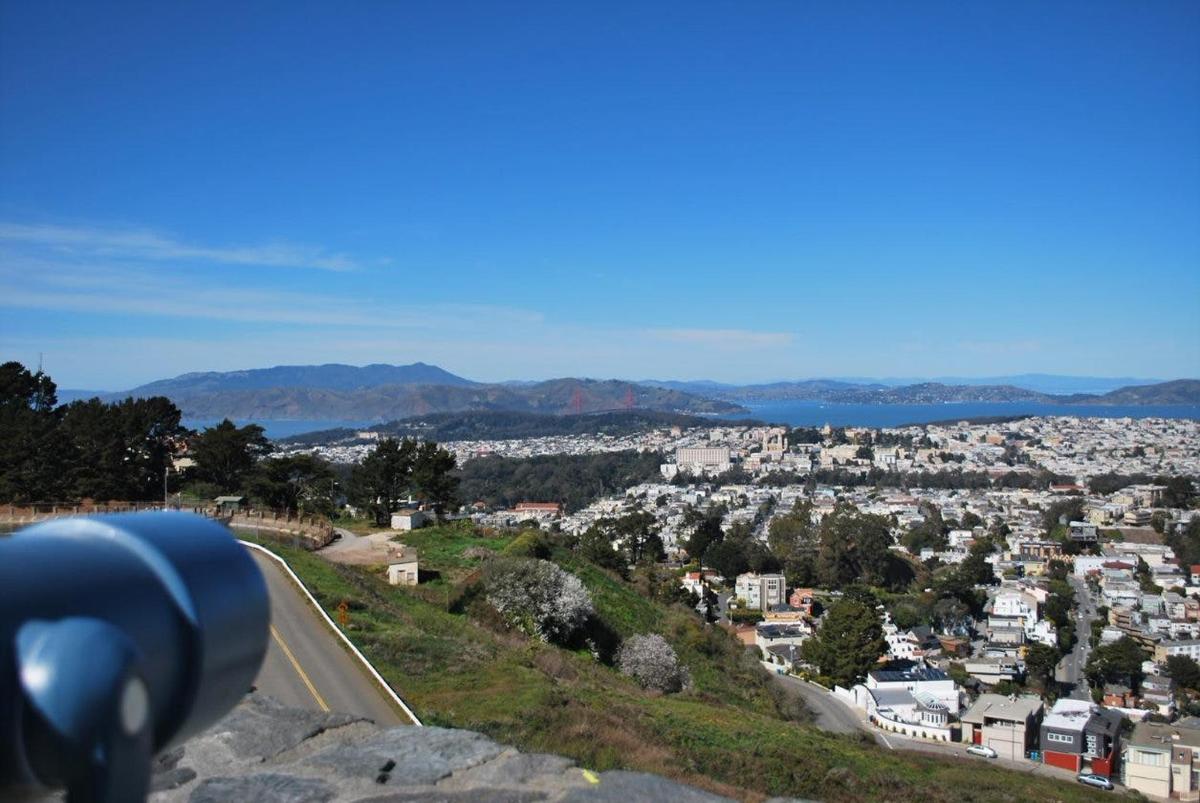a view of a city from the top of a hill
