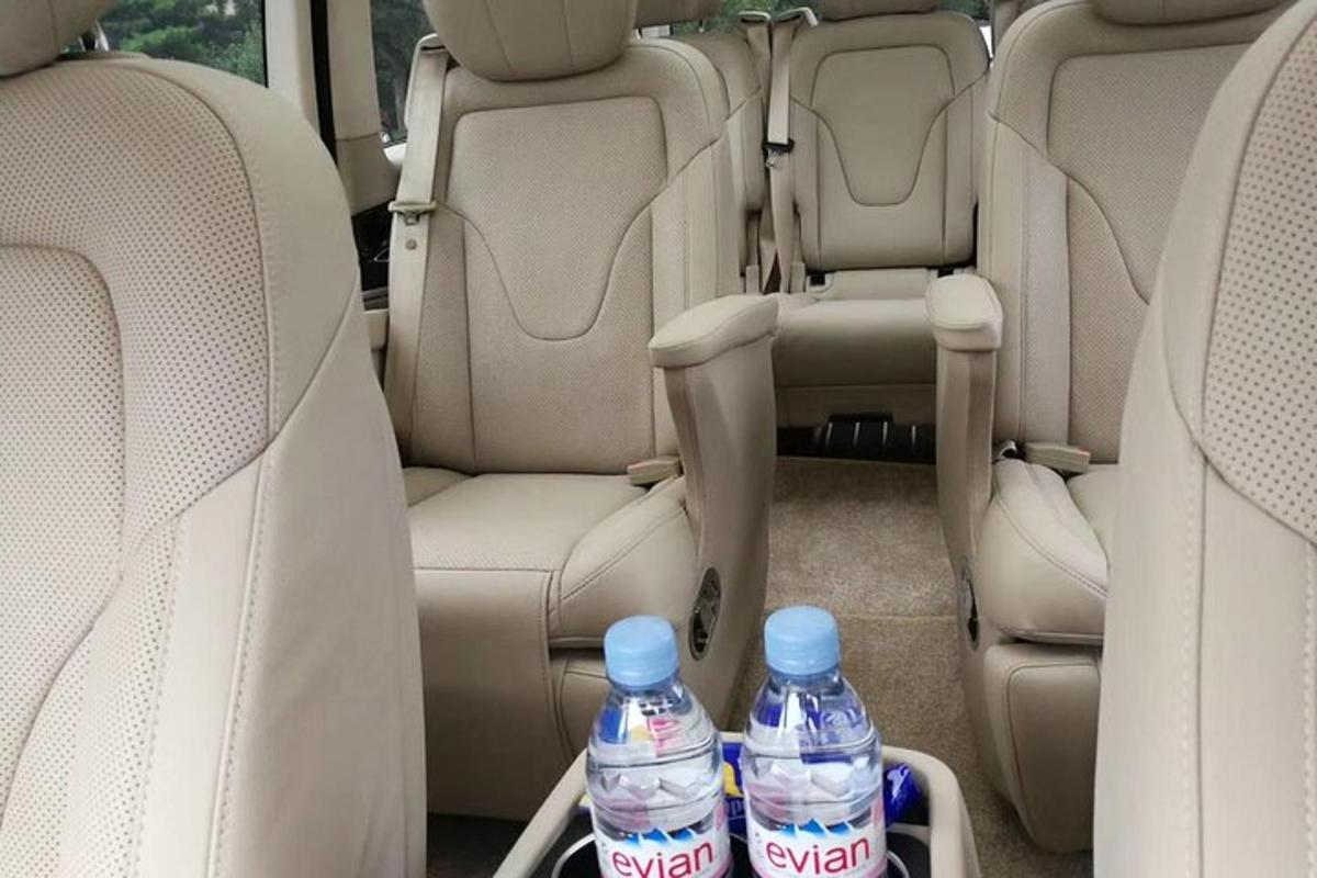 two bottles of water sitting in the back seats of a car