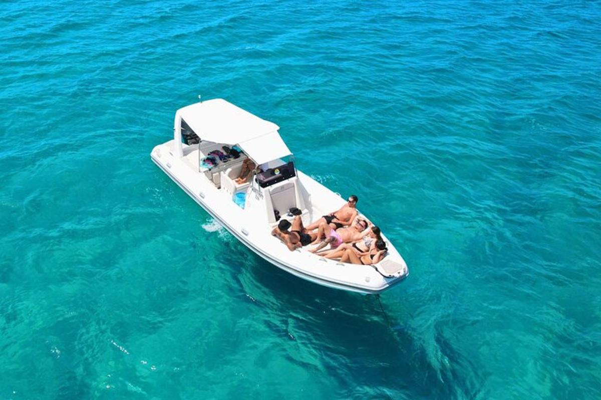 a group of people in a boat in the water