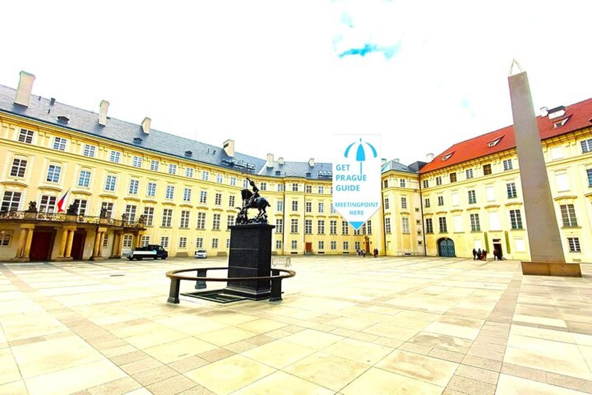 a large building with a clock in front of it