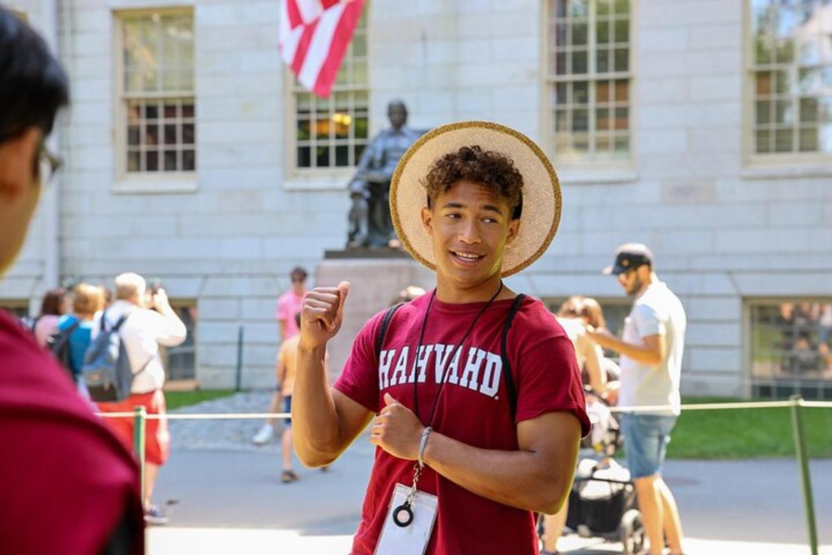 a man wearing a straw hat standing in front of a building
