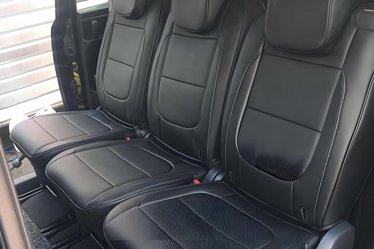 two empty seats in the back of a car