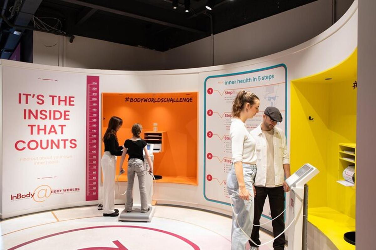a group of people standing in a exhibit at a museum