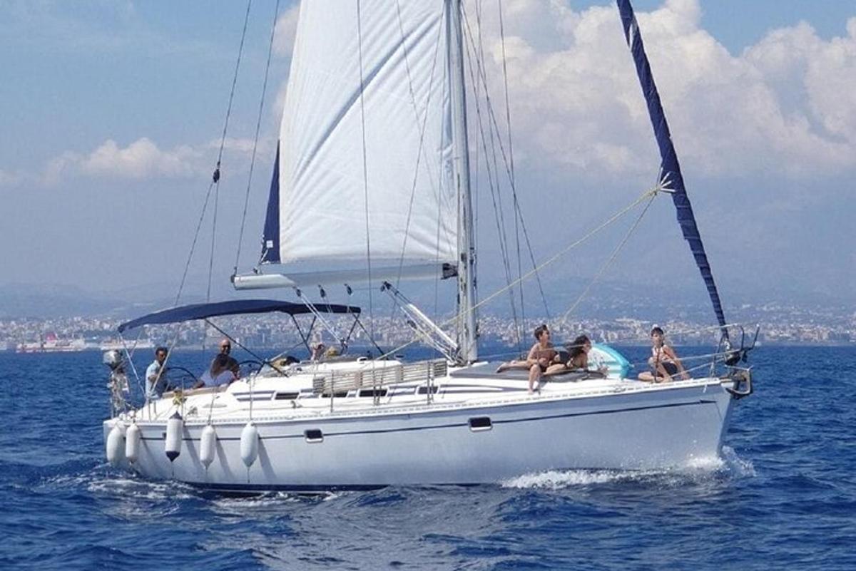 a group of people on a sailboat in the water