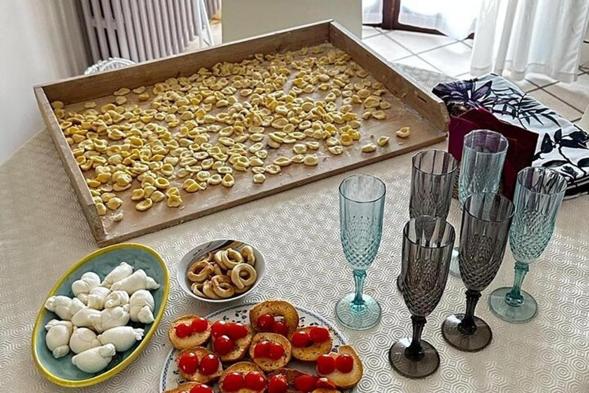 a table with a tray of nuts and glasses