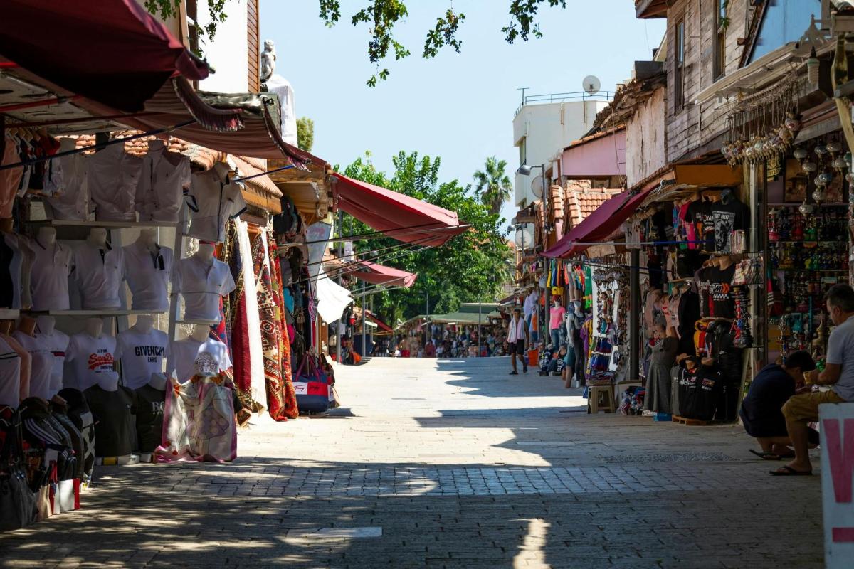 a street in a market with many shops