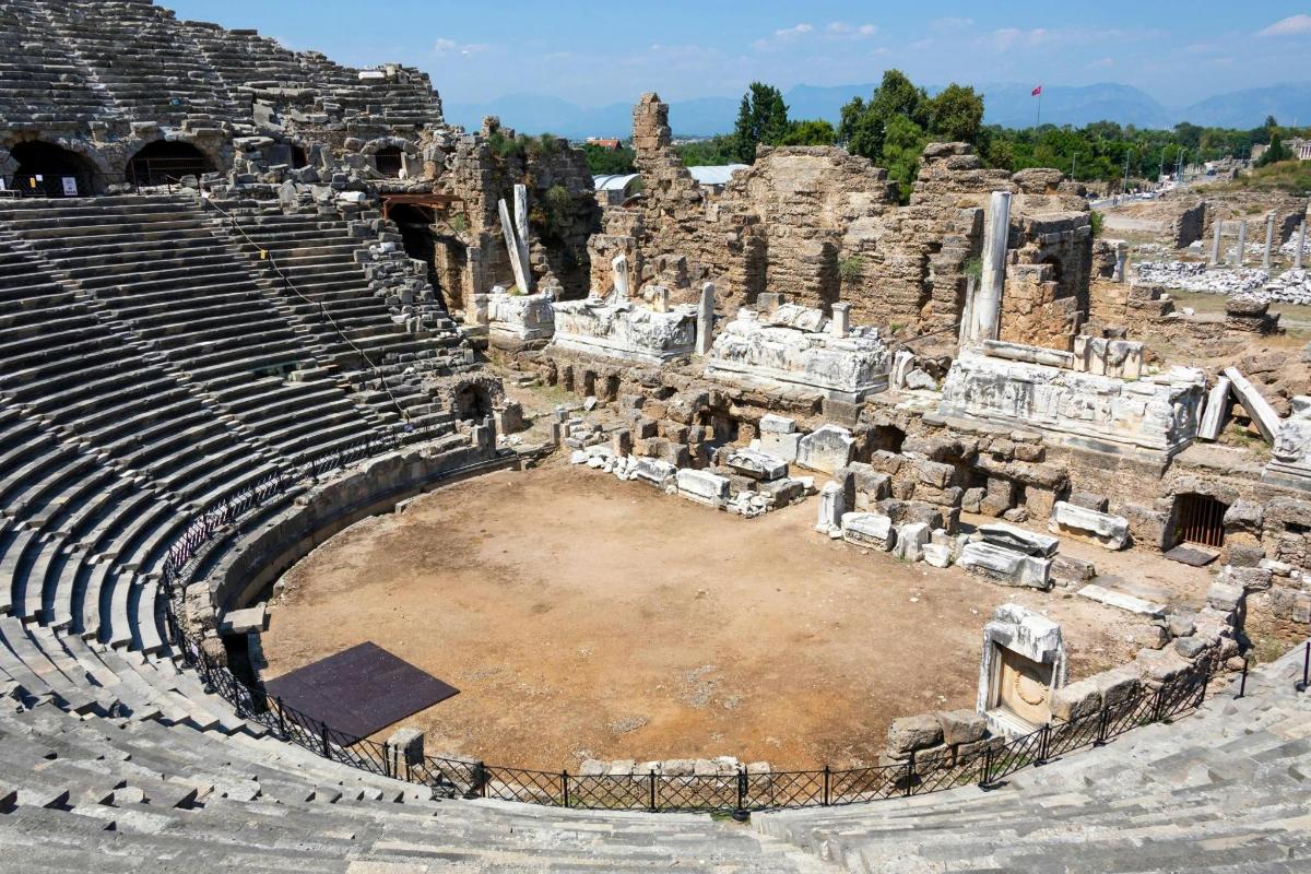 an amphitheatre in the ruins of the ancient theatre