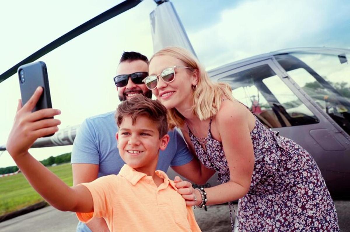 a group of people standing in front of a plane