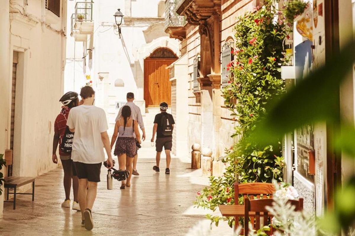 a group of people walking down a street