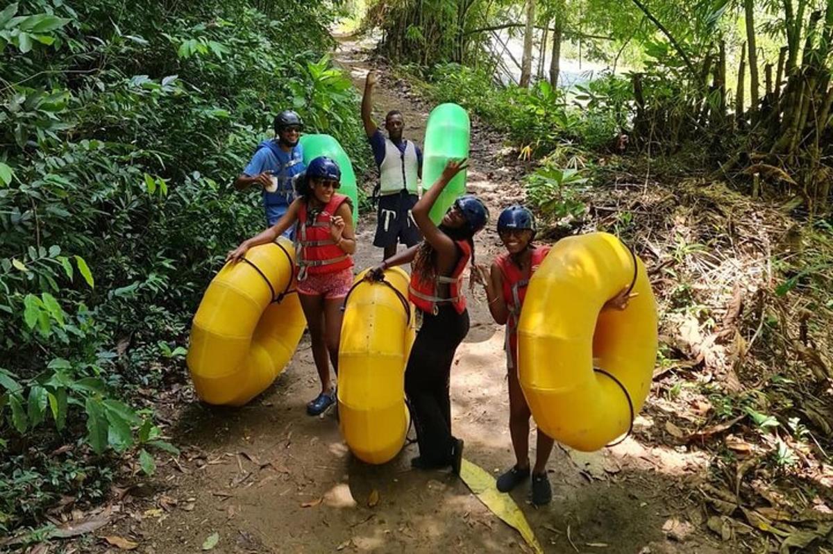 a group of people in inflatable tubes on a trail