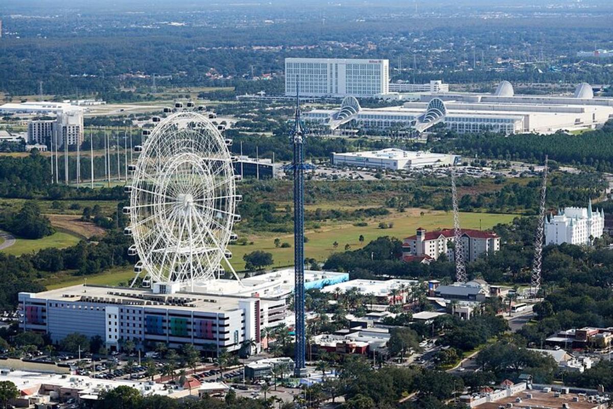 an aerial view of a city with a ferris wheel