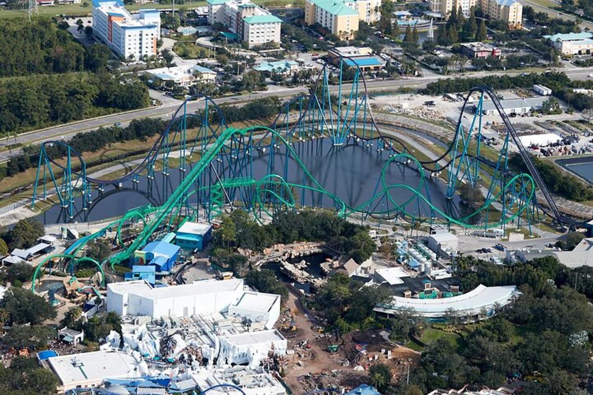an aerial view of a roller coaster in a park