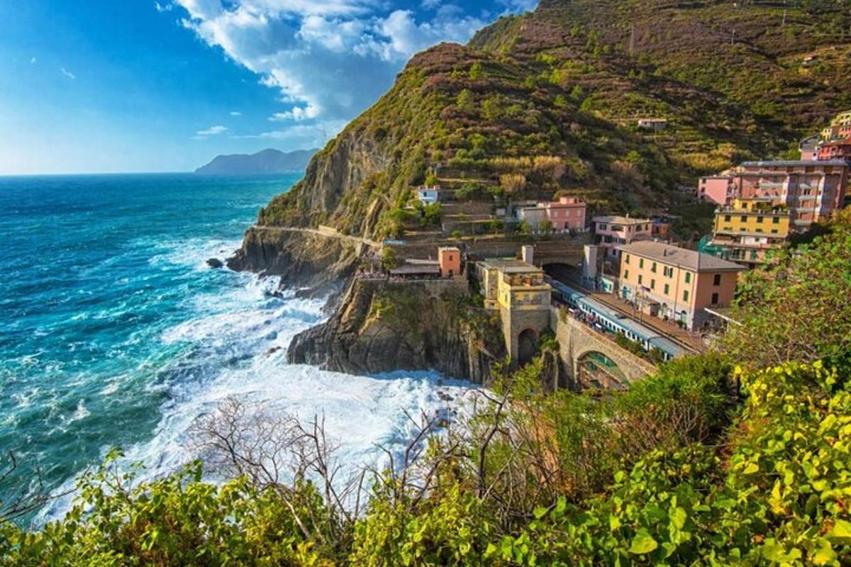 a town on a cliff next to the ocean