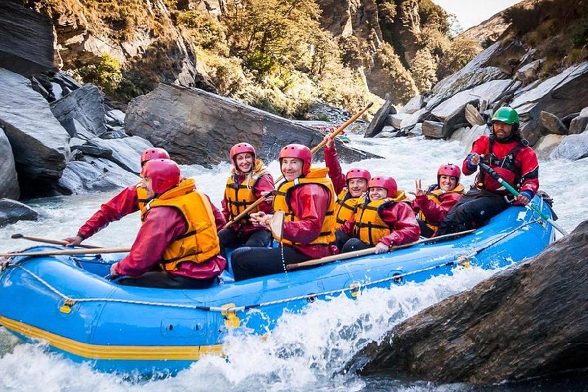a group of people in a raft on a river
