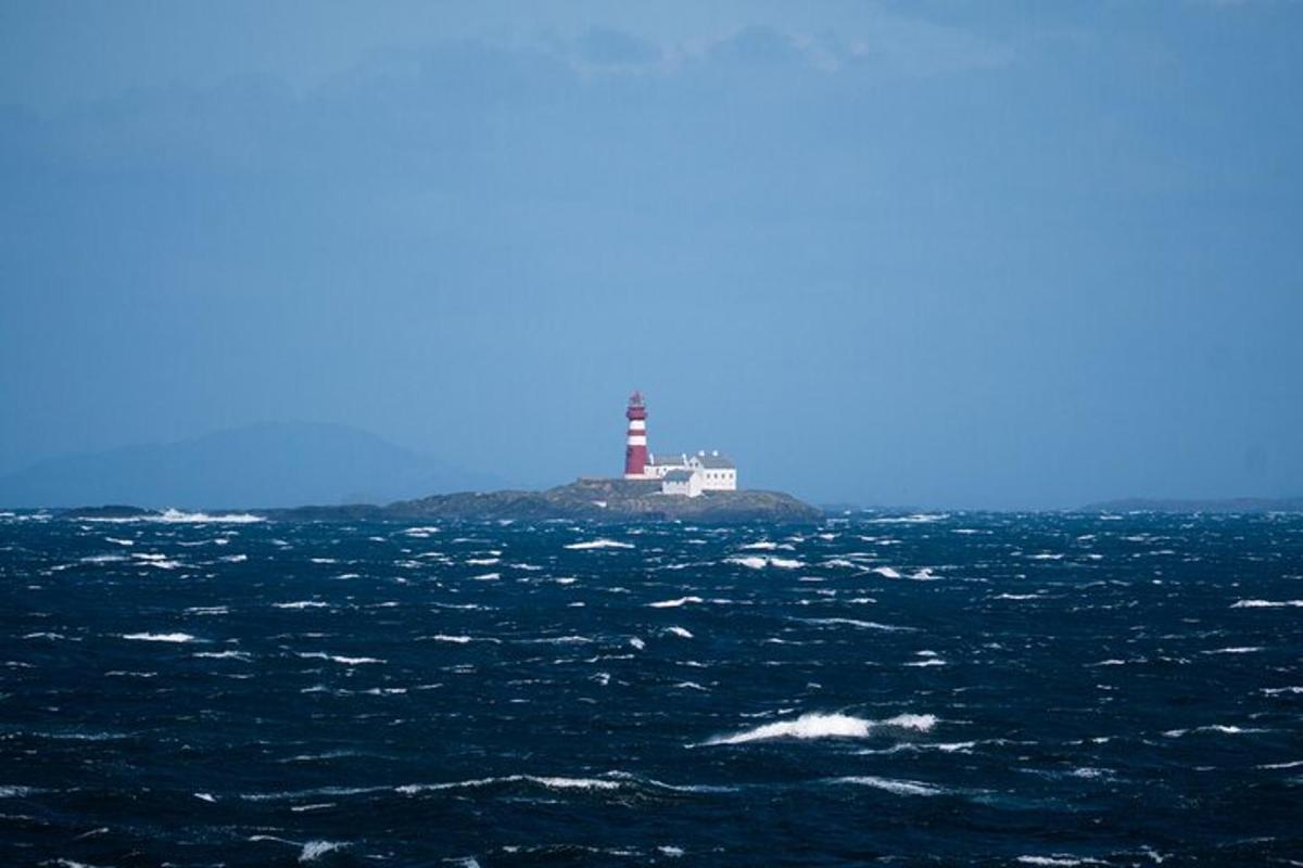 a lighthouse in the middle of a large body of water