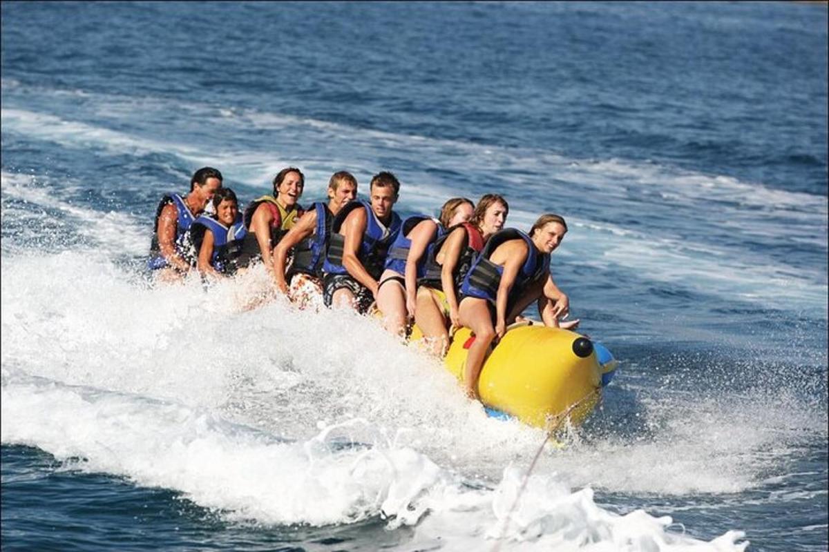 a group of people riding on a raft in the water