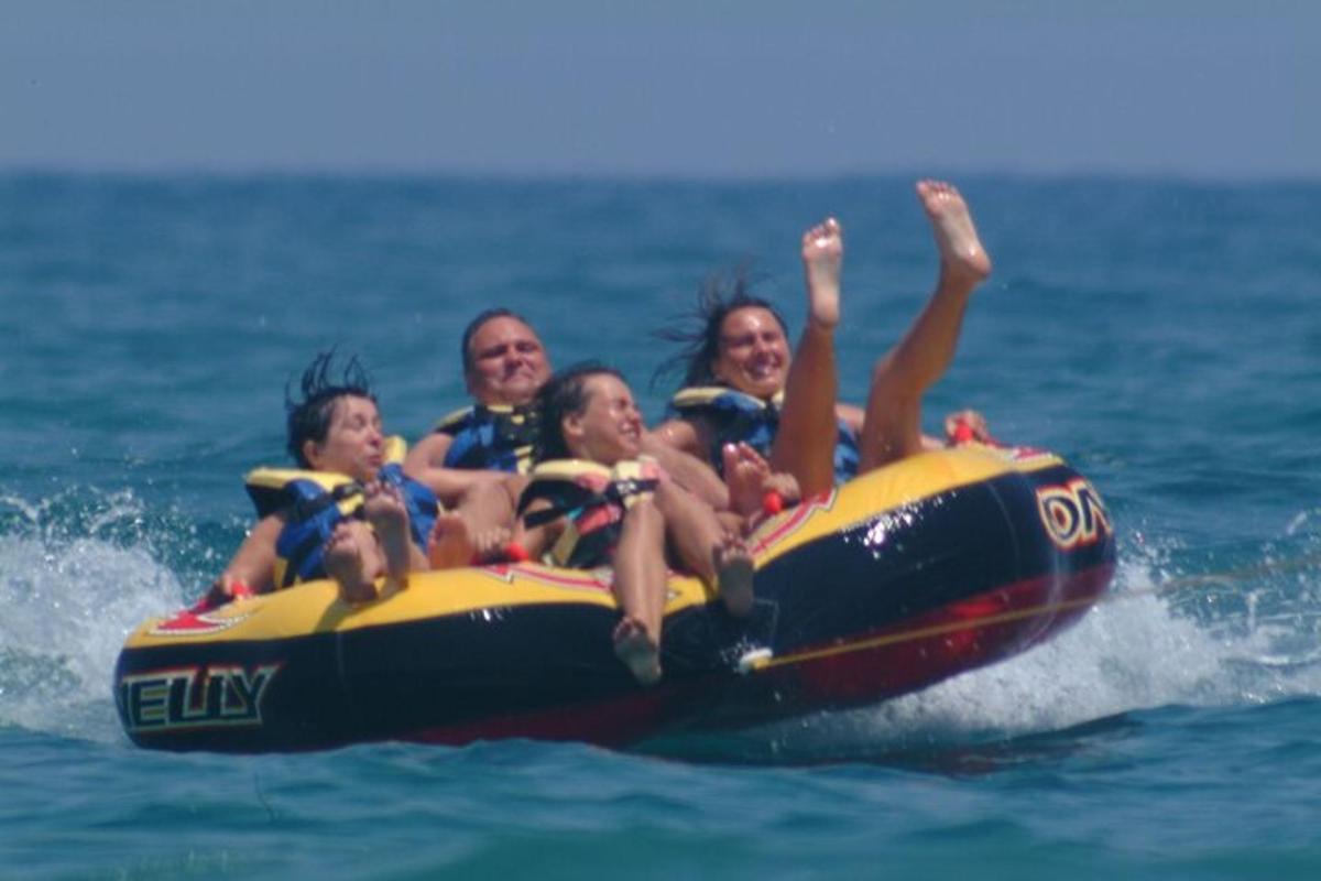 a group of people riding on a raft in the water