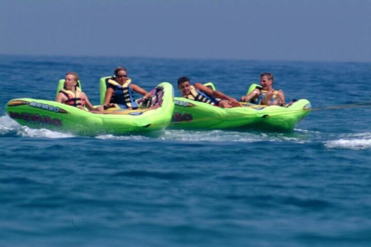 a group of people riding on a raft in the water
