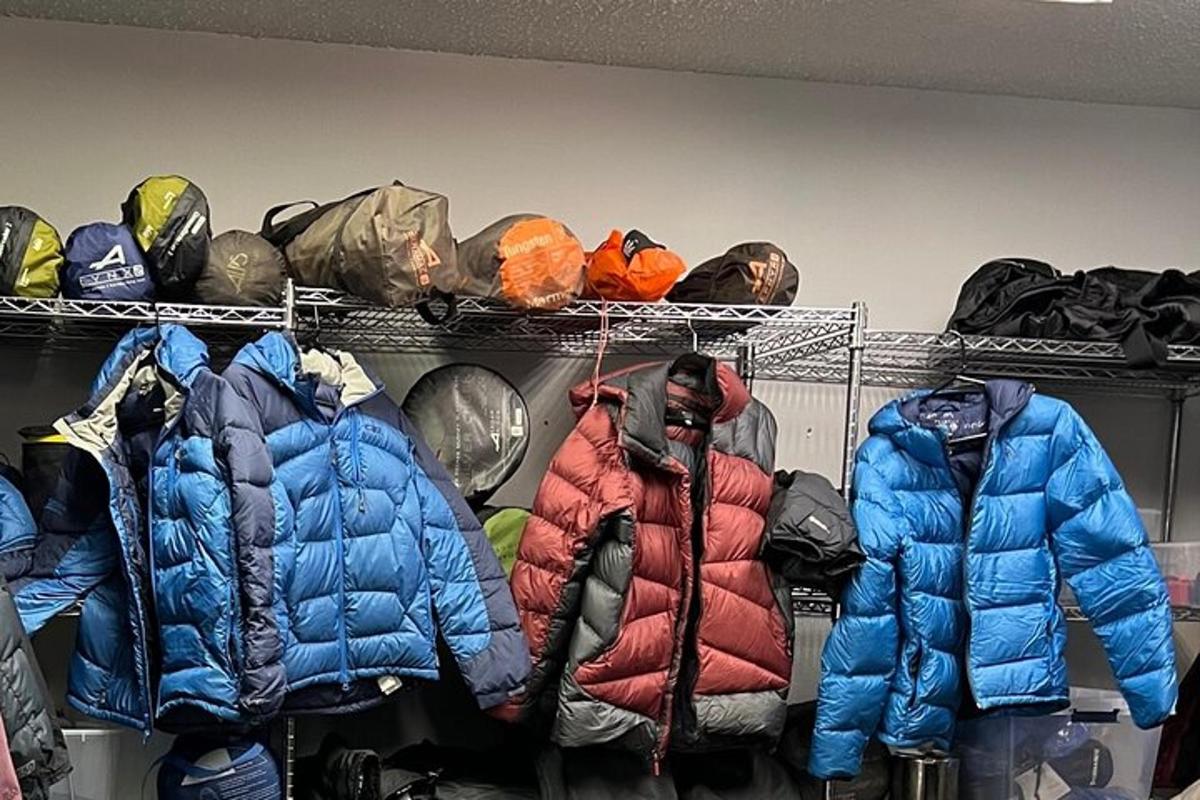 a bunch of jackets are sitting on a shelf